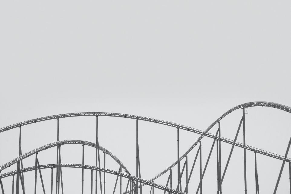 white metal bridge under white sky